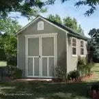 Installed Meridian 8 ft. x 10 ft. Wood Storage Shed with Autumn Brown Shingles